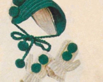 May include: A set of crocheted baby mittens and a bonnet with green and white yarn. The mittens and bonnet have green pom-poms.