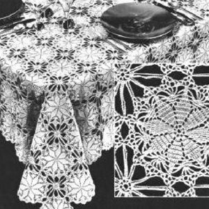 May include: A white crocheted tablecloth with a floral design. The tablecloth is made with a delicate, openwork pattern. The tablecloth is shown on a table with a plate and silverware.