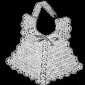 May include: White crocheted baby bib with a scalloped edge and a bow at the neck.
