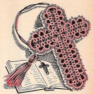 May include: A pink crocheted cross bookmark with a tassel, resting on a closed book with a small cross on the cover.