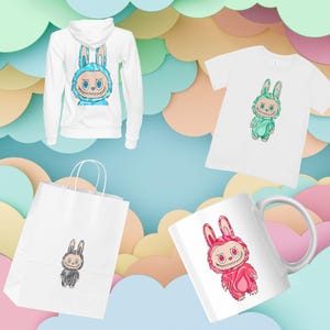 May include: A white hoodie, t-shirt, shopping bag, and mug featuring a cartoon bunny character. The bunny is depicted in various colors and outfits, including blue, green, black, and pink. The background is a pastel color palette.