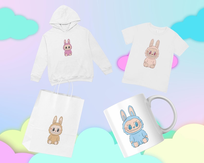 Puede incluir: Una colecci&oacute;n de productos con un dise&ntilde;o de conejo de dibujos animados. Incluye una sudadera con capucha blanca, una camiseta blanca, una bolsa de papel blanca y una taza blanca. El conejo tiene un dise&ntilde;o &uacute;nico con una cara sonriente y en diferentes colores.
