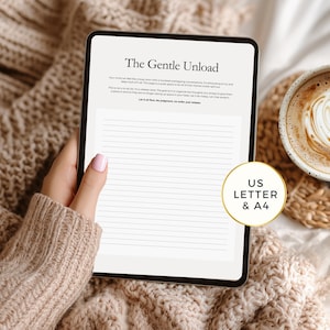 May include: A digital tablet displaying a lined journal page with the title "The Gentle Unload." The tablet is held over a cozy, textured blanket. A coffee cup with latte art sits nearby. The journal is available in US Letter and A4 sizes.