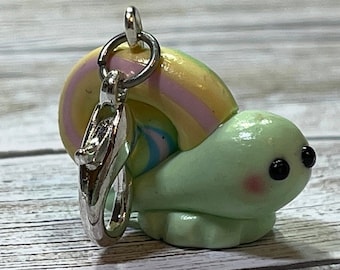 Darling little pale green snail with rainbow swirl shell charm/pendant