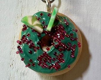 Miniature polymer clay Christmas donut charm with red sprinkles & winterment candies