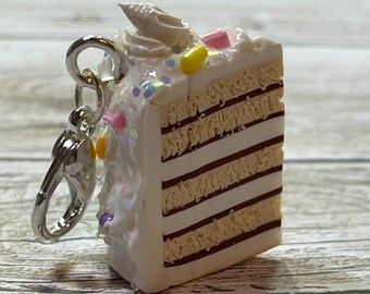 Miniature vanilla chocolate cake slice with vanilla frosting swirls and sprinkles charm/pendant kawaii food