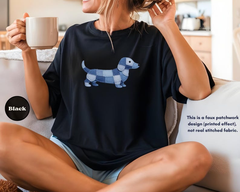 May include: Black t-shirt featuring a blue and white patchwork dachshund design. The text on the image says, "This is a faux patchwork design (printed effect), not real stitched fabric."