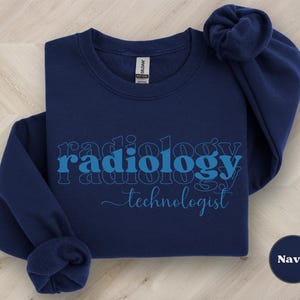 May include: Navy blue sweatshirt with the text "radiology technologist" in a blue outline.