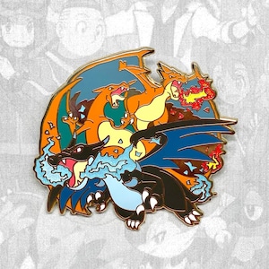 May include: A gold-coloured enamel pin featuring three Pokemon characters: Charizard, Blastoise, and Venusaur. The pin is circular and shows the three Pokemon in a dynamic pose, with Charizard and Venusaur facing each other and Blastoise in the foreground. The pin is detailed with vibrant colours and intricate designs.