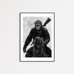 May include: A black and white photograph of a chimpanzee riding a horse in a snowy landscape. The chimpanzee is holding a rifle and is looking directly at the camera.