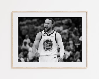 May include: Black and white photo of a basketball player wearing a Golden State Warriors jersey with the number 30 on it. The player is yelling and has a determined expression on his face.