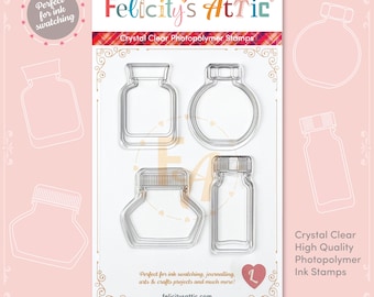 May include: Set of five clear photopolymer stamps featuring different shaped ink bottles. The stamps are designed for ink swatching, journaling, arts and crafts projects. The text "Felicity's Attic" and "Crystal Clear Photopolymer Stamps" is printed on the card.