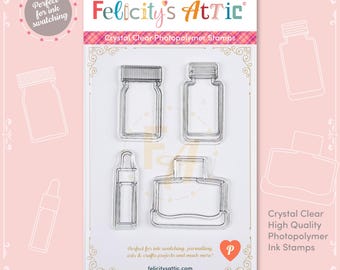 May include: A set of clear photopolymer ink stamps from Felicity's Attic. The stamps include four different bottle and jar shapes. The packaging is white with pink accents and text that reads "Perfect for ink swatching".