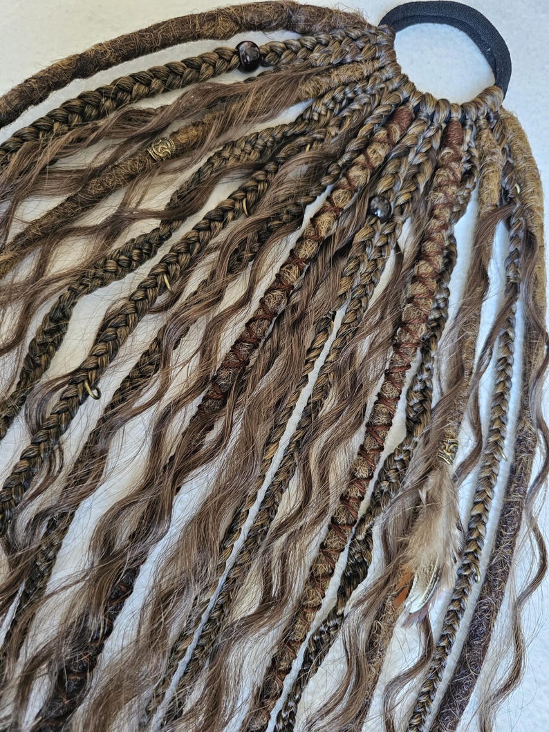 Handmade kinky curly ponytail with brown braids tail, featuring a mix of curls, braids, and dreadlocks. Decorated with feathers, copper charms, beads, and threads, this piece is perfect for bohemian styles or adding a unique touch to your look.