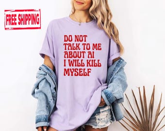 May include: A light purple short-sleeved t-shirt featuring red text that reads DO NOT TALK TO ME ABOUT AI I WILL KILL MYSELF. The shirt has a crew neckline and is worn with a blue denim jacket and distressed denim shorts.