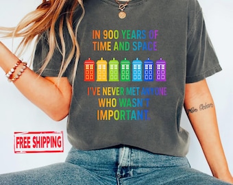 May include: Dark grey t-shirt with a rainbow design of colorful telephone booths and text that reads "IN 900 YEARS OF TIME AND SPACE I'VE NEVER MET ANYONE WHO WASN'T IMPORTANT."