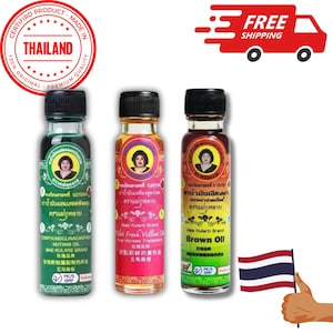 May include: Three small glass bottles with labels in Thai. The bottles contain green, yellow, and brown liquid. The labels include the text "Mae Kularb Brand" and "Brown Oil".