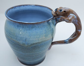 Playful Otter Mug in Soft Blues
