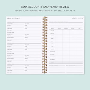 May include: A white planner with a gold spiral binding. The left page has a section for bank accounts with headings for account name, account type, routing transit, card number, expiry date, and notes. The right page has a section for yearly review with headings for what did I learn by tracking my finances, month, income, expenses, earnings, debt, what did I do well, and what can I improve.