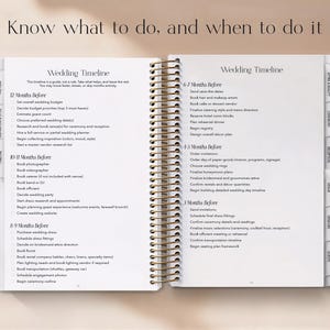 May include: Open wedding planner with a spiral binding, featuring a detailed wedding timeline. The pages are white with black text, and the planner includes sections for planning 12, 10-11, 8-9, 6-7, 4-5, and 3 months before the wedding.