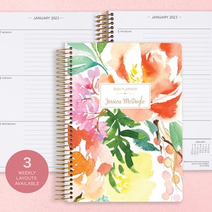 6x9 inches Posy Paper Co. 2023/2024 weekly planner with the citrus watercolor floral cover design showcasing horizontal layout in the background