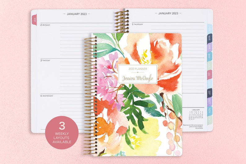 6x9 inches Posy Paper Co. 2023/2024 weekly planner with the citrus watercolor floral cover design showcasing horizontal layout in the background