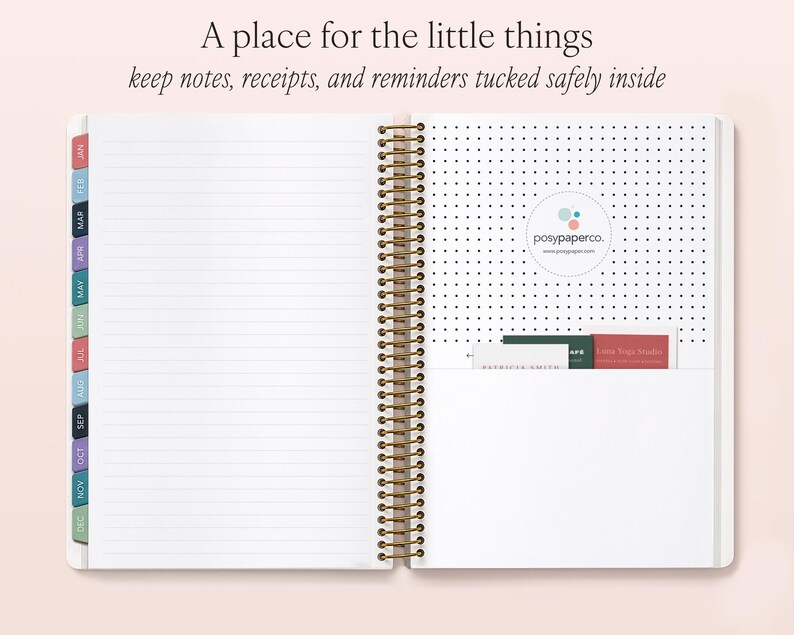 an open spiral-bound notebook with a blank page, a pocket on the right side, and a section of the notebook with a logo and text visible.