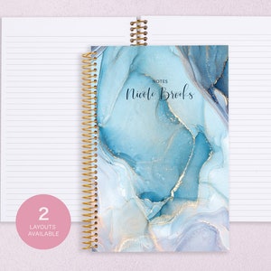 May include: A blue and gold marble patterned spiral bound notebook with the text "NOTES" and "Nicole Brooks" on the cover.