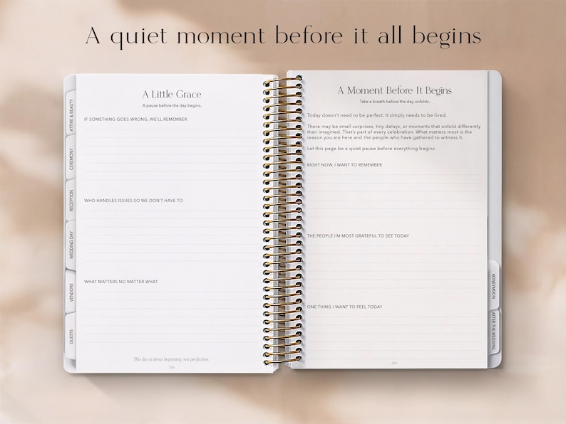 May include: Open planner with gold spiral binding, featuring lined pages and section tabs. Text on the left page reads "A Little Grace" and on the right page "A Moment Before It Begins". The top text says "A quiet moment before it all begins".