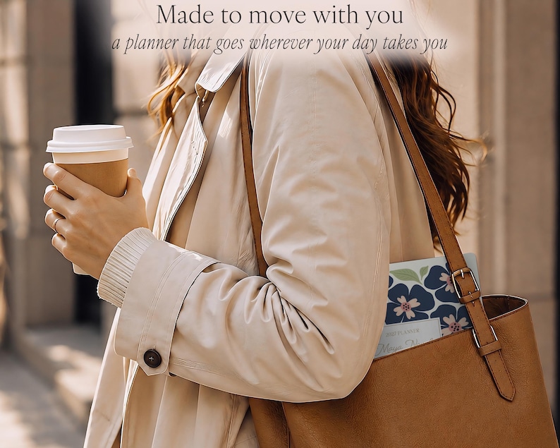 May include: A planner with a dark blue and pink floral pattern tucked into a brown leather tote bag. The text "Made to move with you" and "a planner that goes wherever your day takes you" is visible at the top of the image above the bag.