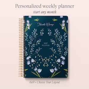 May include: A dark blue weekly planner with a gold spiral binding, featuring a floral pattern of light blue and green stems. The cover displays the text Nicole Camp, 2027 PLANNER, Personalized weekly planner, start any month, and 6x9 Choose Your Layout.