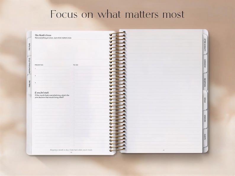 May include: Open planner with lined pages and gold spiral binding. The text "Focus on what matters most" is at the top. The planner includes sections for priorities and to-do lists, with tabbed dividers for organization.