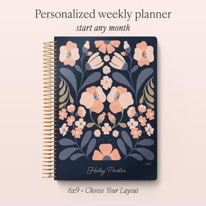 May include: A dark blue weekly planner with a gold spiral binding, featuring a symmetrical floral pattern in shades of peach, light pink, and muted blue. The cover displays the text Personalized weekly planner, start any month, 6x9, and Haley Parker.