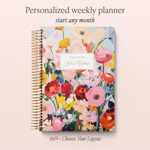 May include: A spiral-bound weekly planner featuring a colourful floral painting on the cover with red, pink, yellow, and blue flowers. The centre label reads 2027 PLANNER Julia Bishop. Text above reads Personalized weekly planner start any month.