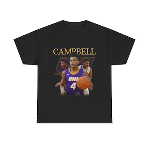 May include: Black t-shirt with a basketball player wearing a purple and gold jersey with the text "Campbell" and "UNI 4" on it.