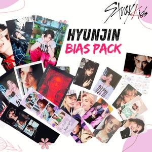 Paquete Bias de Hyunjin Stray Kids: álbum Stay Kids Ate con tarjetas fotográficas de Hyunjin y Polaroids.