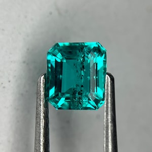 0.54 Ctw Lab Grown Paraiba (Hydrothermal) Emerald Cut w/inclusions, 5.8 x 4.5 (mm)