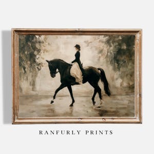 May include: A framed vintage-style print depicts a person riding a black horse. The rider wears a dark coat and hat with a light-colored skirt. The artwork has a muted color palette with the text "RANFURLY PRINTS" at the bottom.