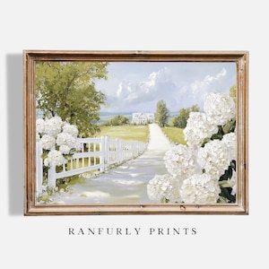 May include: A framed landscape print featuring a white farmhouse at the end of a long, white-fenced lane. White hydrangeas frame the scene, with a light blue sky and green trees. The text "RANFURLY PRINTS" is at the bottom.