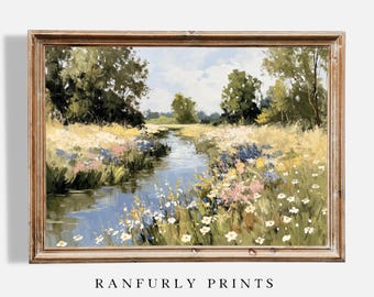 Puede incluir: Pintura de paisaje enmarcada que representa una serena escena fluvial. La obra presenta un río que fluye rodeado de flores silvestres en tonos blancos, rosas y azules. Frondosos árboles verdes y un cielo azul completan la vista pastoral.