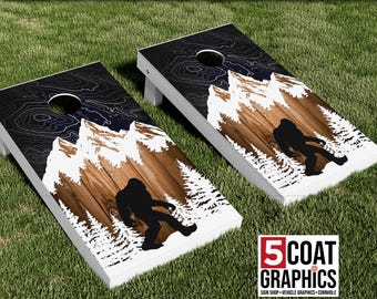 Bigfoot Snow Covered Mountains & Map Lines resembles Northern Lights 2 Vinyl Cornhole Wraps Sasquatch Camping Game Skins Yard Game Decals