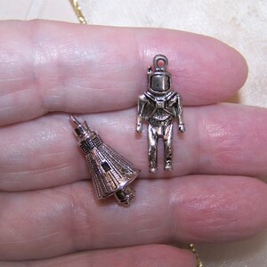 Charm pendant astronaut with stones and cold enamel silver blackened