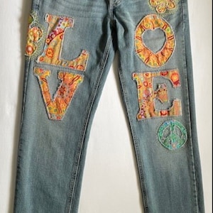 Upcycled unisex Levi W33 L32 denim unique original art jeans hippie music festival Bohemian 1970  patched peace love flowers hand embroidery