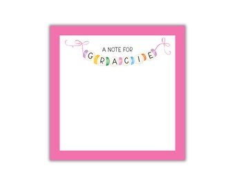 May include: A pink notepad with a matching pink border. The notepad has the text "A NOTE FOR GRACIE" in a whimsical font, with colorful accents. The design is cheerful and suitable for personal notes.