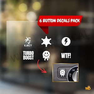May include: A set of six white button decals featuring icons and text such as "EJECT", a star, a lightning bolt, "TURBO BOOST", a melting smiley face, and "WTF!". The decals are displayed on a car dashboard.