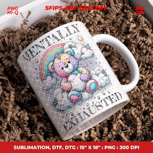 May include: White ceramic mug with a colorful illustration of a teddy bear on clouds, a rainbow, and the words "MENTALLY EXHAUSTED". The mug has a white handle and is surrounded by brown packing material.