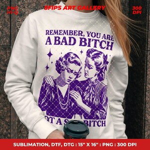 May include: White sweatshirt with a purple graphic featuring two women and the text "REMEMBER, YOU ARE A BAD BITCH NOT A S BITCH". The graphic is a vintage-style illustration. The sweatshirt is 15" x 16".