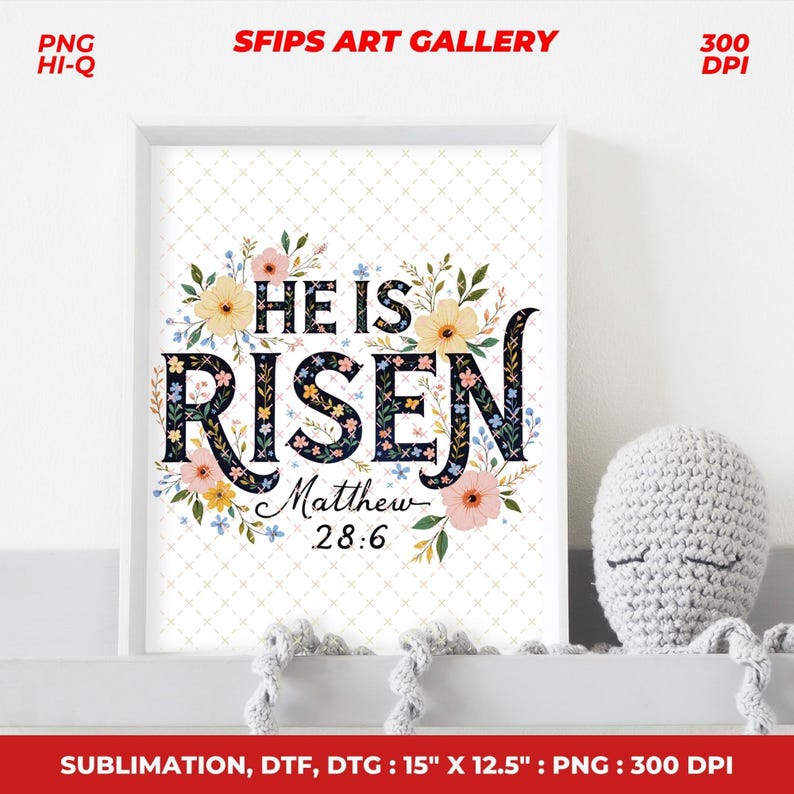 May include: A framed art print with the words "HE IS RISEN" in a floral design. The print includes the text "Matthew 28:6". The frame is white, and the print measures 15" x 12.5".