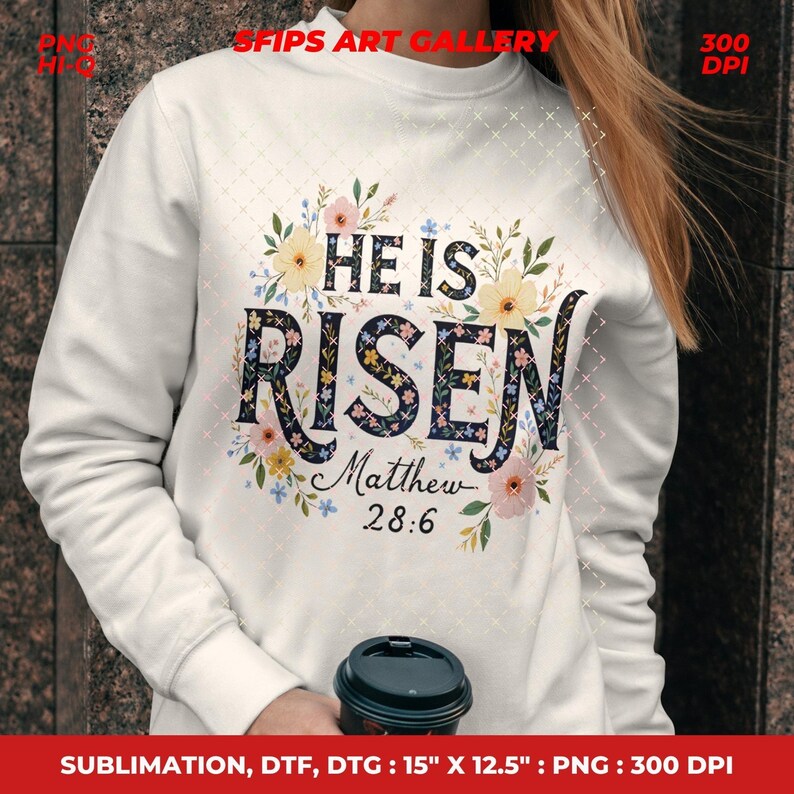 May include: White sweatshirt with the text "HE IS RISEN" in a floral design. The text "Matthew 28:6" is below the main text. The sweatshirt has a crew neck and long sleeves. The image also includes the text "SFIPS ART GALLERY".