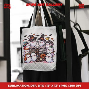 May include: A white tote bag featuring a group of cartoon ghosts reading a book titled "Spooky Book Club." The bag has black handles and the text "Spooky Book Club" is visible. The bag measures 15" x 13".